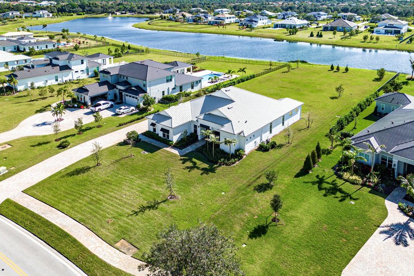 Single story Oakley home with lake views on a just shy 1 acre - Beach Home for sale in Jupiter, Florida on Beachhouse.com
