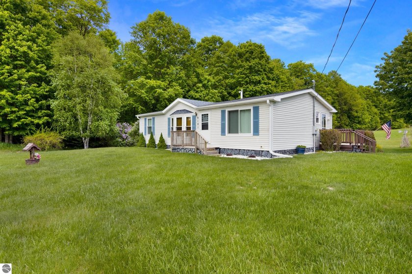 Quiet country roads and rolling countryside lead you just - Beach Home for sale in Maple City, Michigan on Beachhouse.com