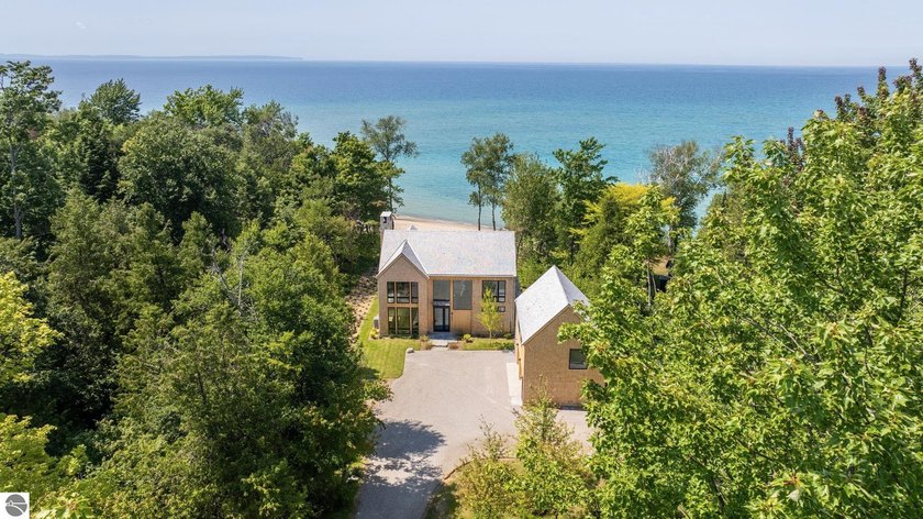 Set along a coveted stretch of Lake Michigan shoreline between - Beach Home for sale in Northport, Michigan on Beachhouse.com