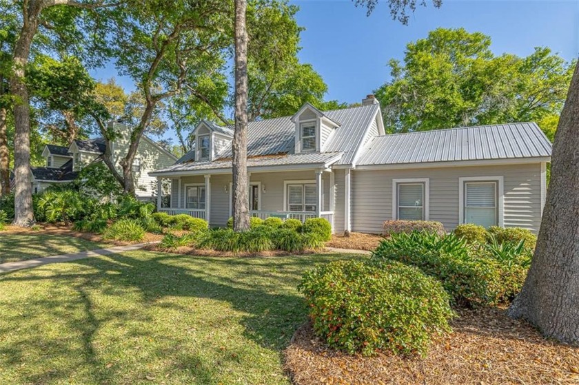 This stunning Cape Cod-style home features 4 bedrooms, 2 1/2 - Beach Home for sale in Saint Simons, Georgia on Beachhouse.com