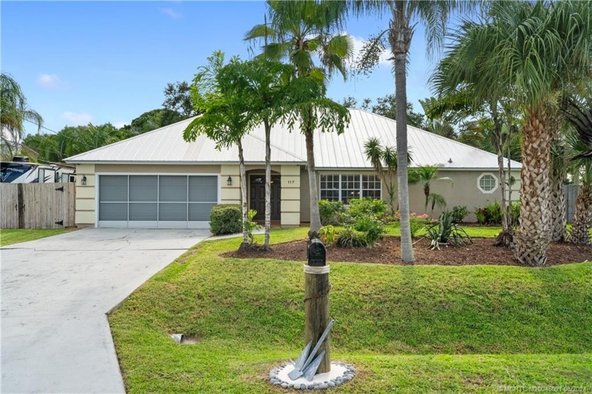 Enjoy serene water views from the screened patio, heated pool - Beach Home for sale in Port Saint Lucie, Florida on Beachhouse.com