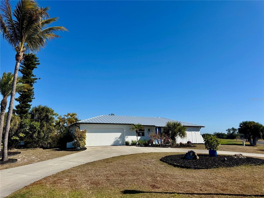 ATTENTION GOLFERS + BOATERS! Positioned on an ELEVATED CORNER - Beach Home for sale in Rotonda West, Florida on Beachhouse.com