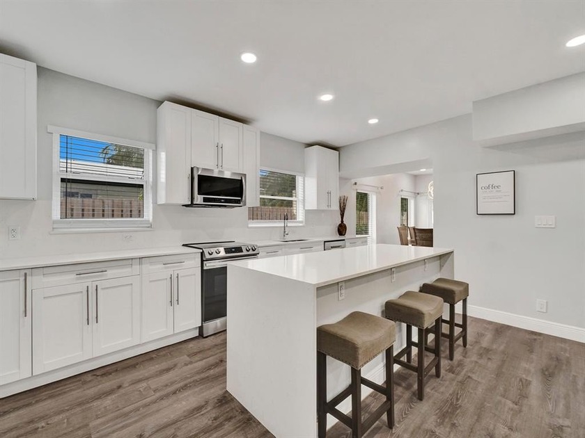 EXPERIENCE MODERN COASTAL LIVING IN THIS BEAUTIFULLY RENOVATED - Beach Home for sale in Pompano Beach, Florida on Beachhouse.com