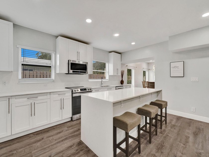 EXPERIENCE MODERN COASTAL LIVING IN THIS BEAUTIFULLY RENOVATED - Beach Home for sale in Pompano Beach, Florida on Beachhouse.com