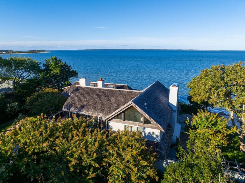 Perched atop the dunes at Louse Point sits a picturesque house - Beach Home for sale in East Hampton, New York on Beachhouse.com