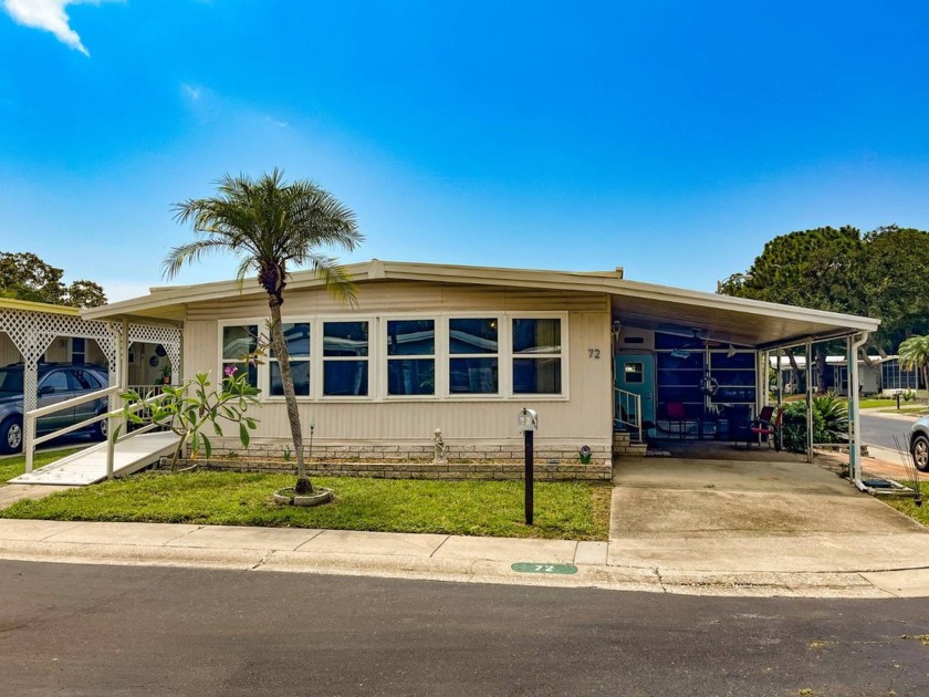 Welcome to your cozy and charming manufactured home! This little - Beach Home for sale in Largo, Florida on Beachhouse.com