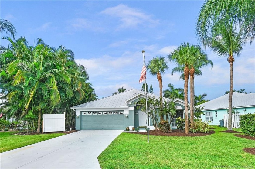 Attractive pool home with lake view in desirable Windemere has a - Beach Home for sale in Jensen Beach, Florida on Beachhouse.com