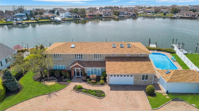 WELCOME TO YOUR WATERFRONT DREAM HOME!! This exquisite  home - Beach Home for sale in Copiague, New York on Beachhouse.com