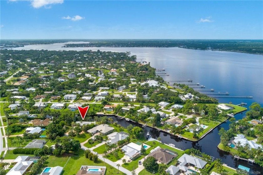 Experience the epitome of waterfront living in this Frank Lloyd - Beach Home for sale in Stuart, Florida on Beachhouse.com