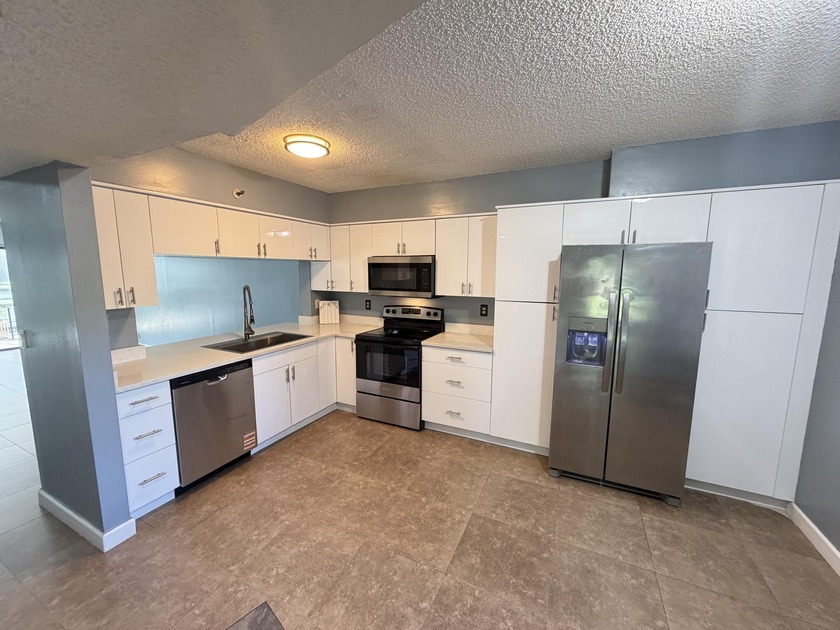 Welcome home to this beautifully maintained first-floor corner - Beach Condo for sale in Pompano Beach, Florida on Beachhouse.com
