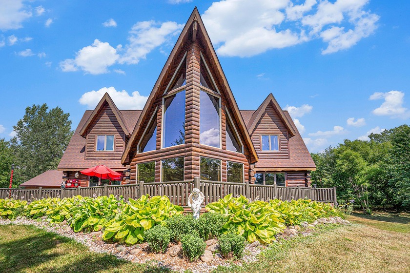 Experience the beauty of log home living in this expansive - Beach Home for sale in Holland, Michigan on Beachhouse.com