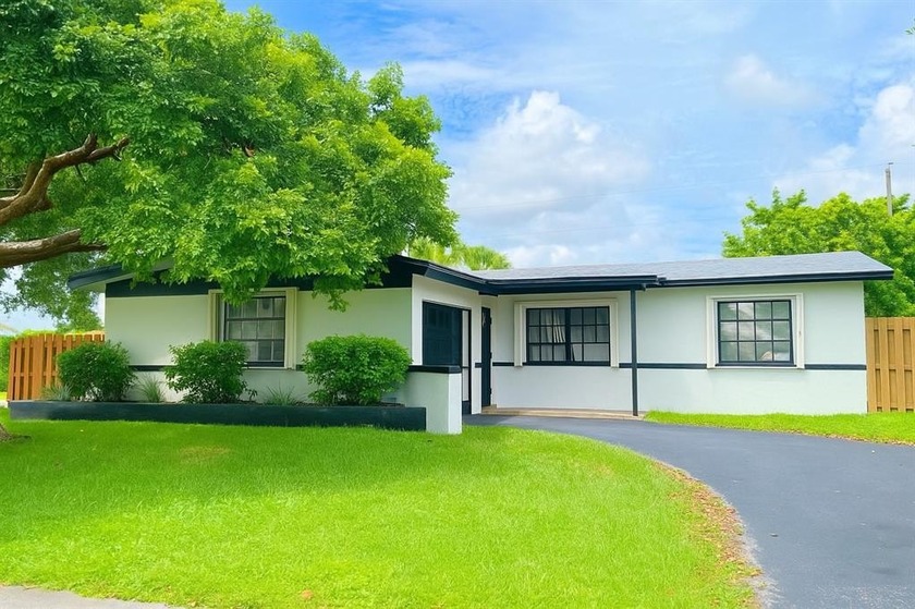 Beautifully remodeled 4-bedroom, 2-bath home located on a - Beach Home for sale in Sunrise, Florida on Beachhouse.com