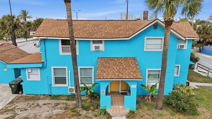 This five-unit multifamily property is located at 715 Harvey - Beach Commercial for sale in Daytona Beach, Florida on Beachhouse.com