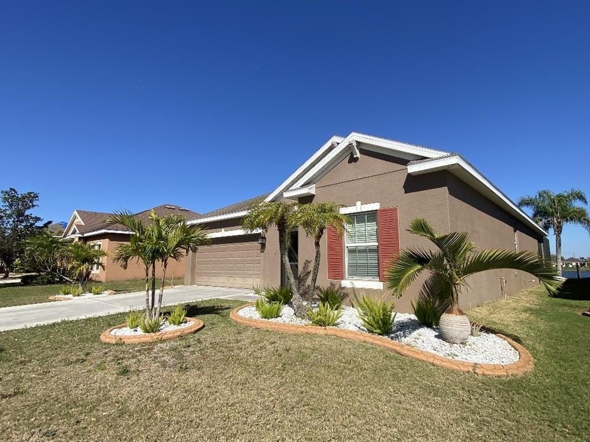 Stunning Lake View Home with Heated Pool, New Landscaping, and - Beach Home for sale in Ruskin, Florida on Beachhouse.com