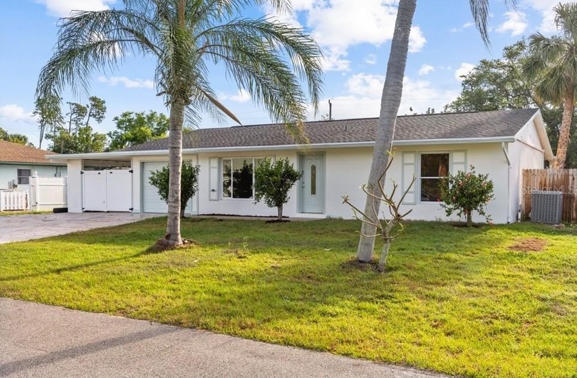 Welcome to your dream home--a charming, fully fenced oasis that - Beach Home for sale in Port Charlotte, Florida on Beachhouse.com