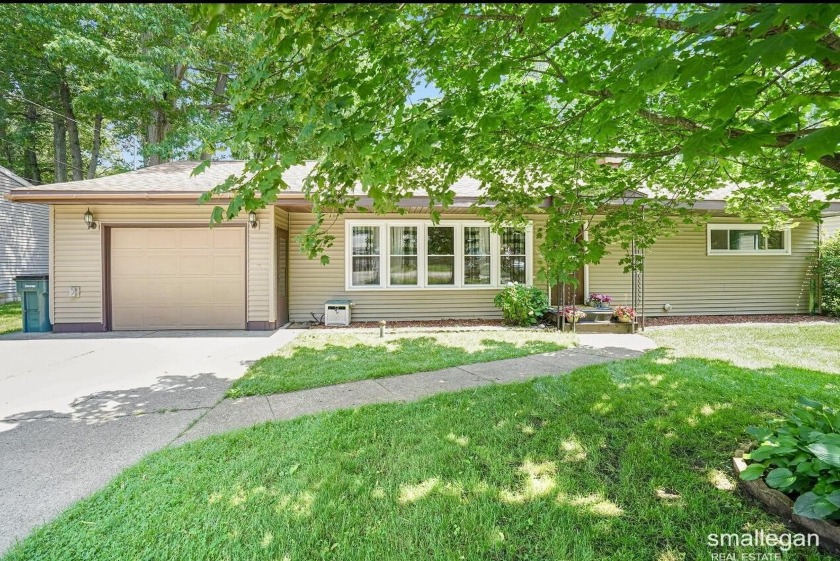 Move-in ready ranch-style home boasting a spacious open floor - Beach Home for sale in Muskegon, Michigan on Beachhouse.com