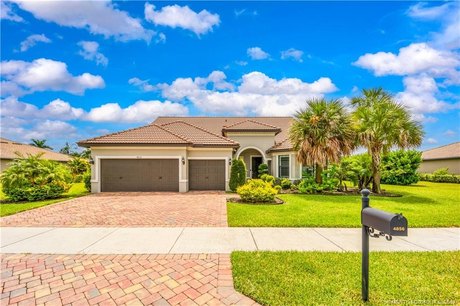 This stunning 4-bedroom, 4-bathroom, 3-car garage pool home - Beach Home for sale in Palm City, Florida on Beachhouse.com