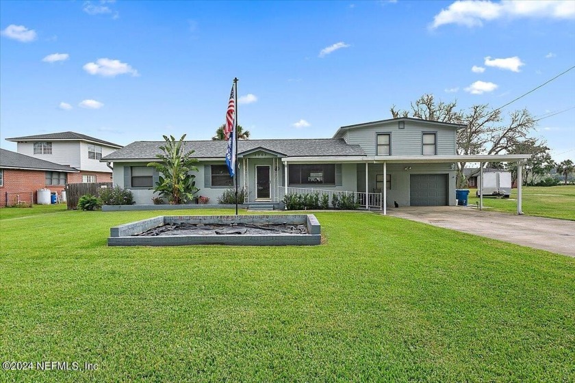 Stunning Riverfront Brick Home on a Private Acre. Nestled on a - Beach Home for sale in Jacksonville, Florida on Beachhouse.com