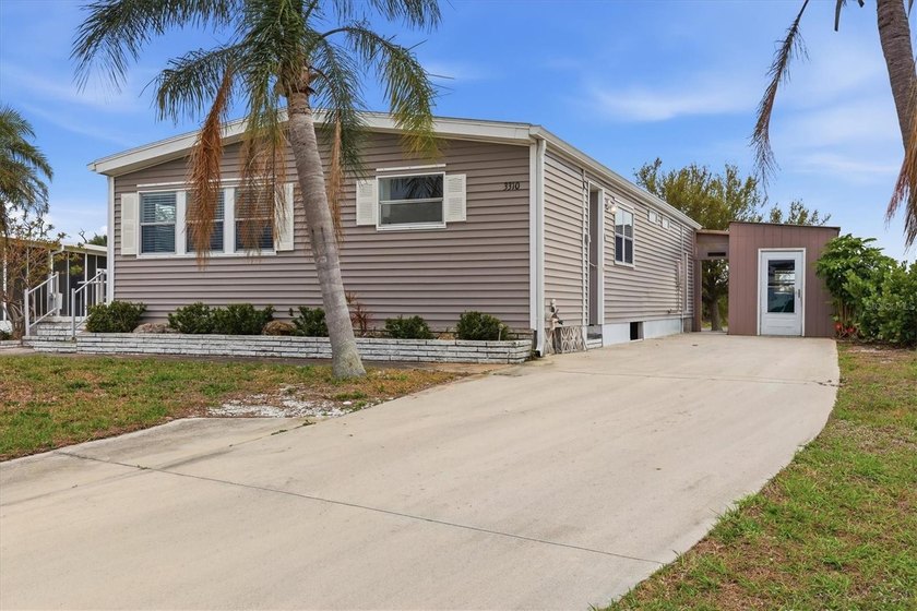 Welcome to this charming double-wide manufactured home located - Beach Home for sale in Englewood, Florida on Beachhouse.com