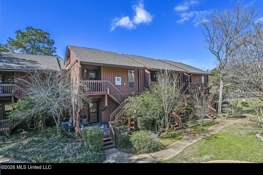 Tucked away in Lakeside Villa Condominiums, this charming - Beach Condo for sale in Diamondhead, Mississippi on Beachhouse.com