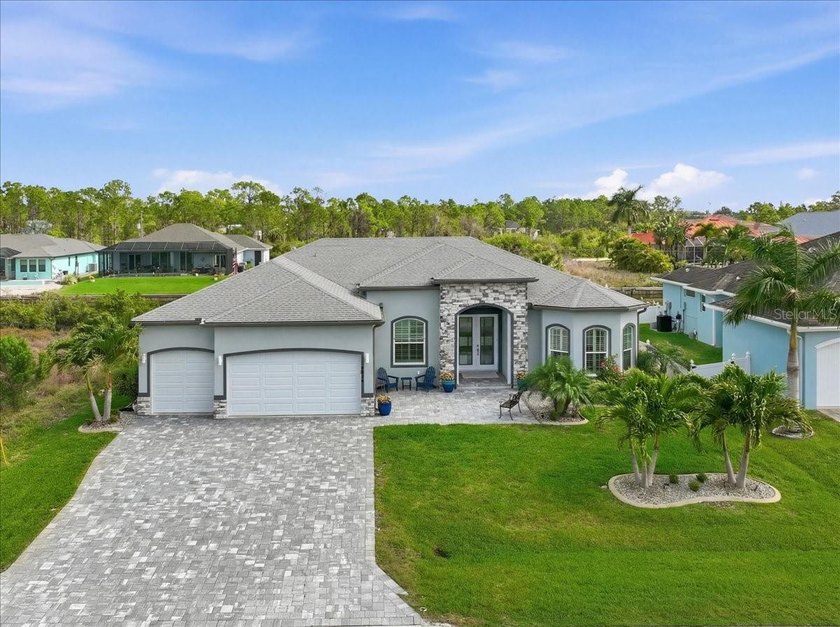 Luxury Waterfront Living in South Gulf Cove - Custom 3BR/3BA - Beach Home for sale in Port Charlotte, Florida on Beachhouse.com