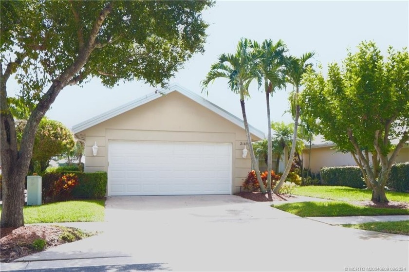 Enjoy expansive lake views from this popular Divosta built - Beach Home for sale in Palm City, Florida on Beachhouse.com