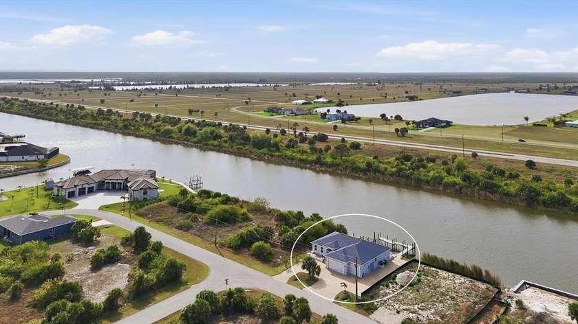 Experience elevated waterfront living in this beautifully - Beach Home for sale in Port Charlotte, Florida on Beachhouse.com