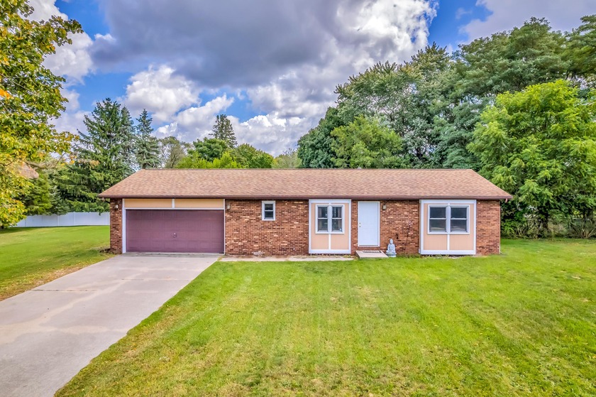 Welcome to this 2-bedroom, 1.5 bath ranch just minutes from the - Beach Home for sale in Whitehall, Michigan on Beachhouse.com