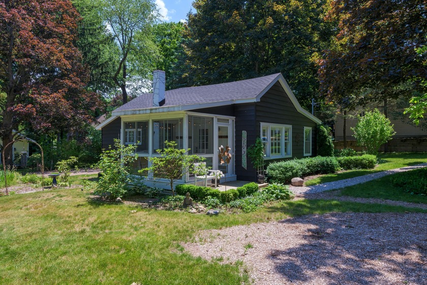 Don't miss this absolute gem on the hill! This charming cottage - Beach Home for sale in Saugatuck, Michigan on Beachhouse.com