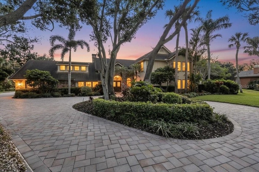 Set on a quiet half-acre in Riverview Landings, this beautifully - Beach Home for sale in Bradenton, Florida on Beachhouse.com