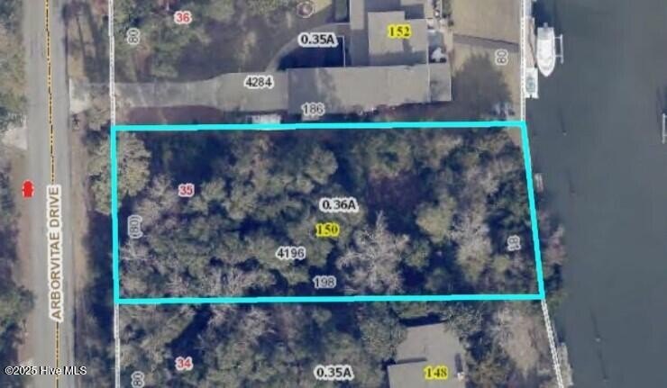 Rare large canal front lot with no bridges restricting access to - Beach Lot for sale in Pine Knoll Shores, North Carolina on Beachhouse.com