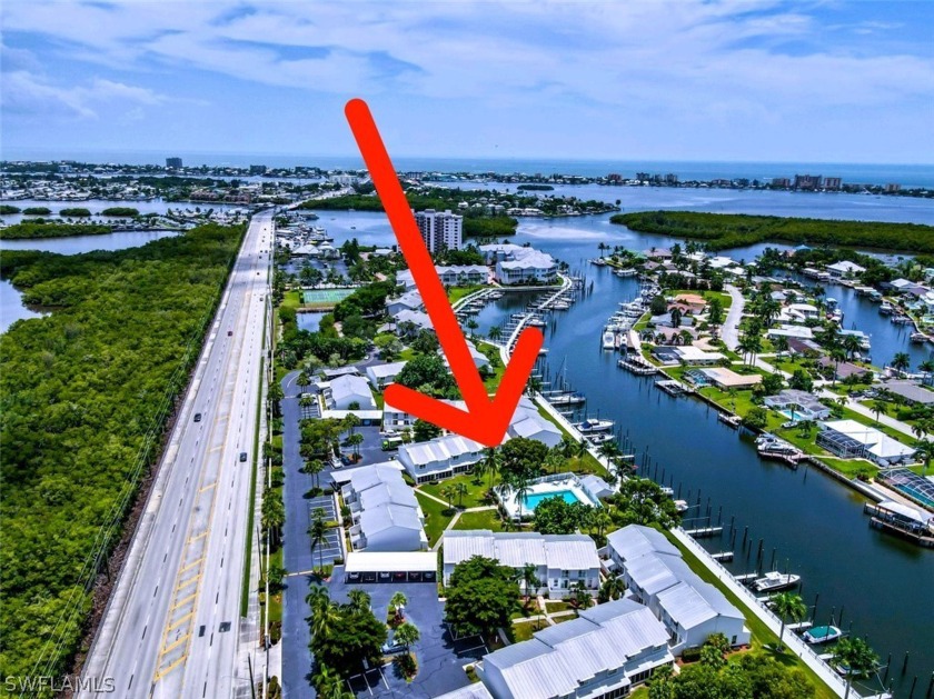 THIS ONE HAS IT ALL.  TWO BOAT SLIPS, CARPORT SPACE, FULLY - Beach Townhome/Townhouse for sale in Fort Myers Beach, Florida on Beachhouse.com
