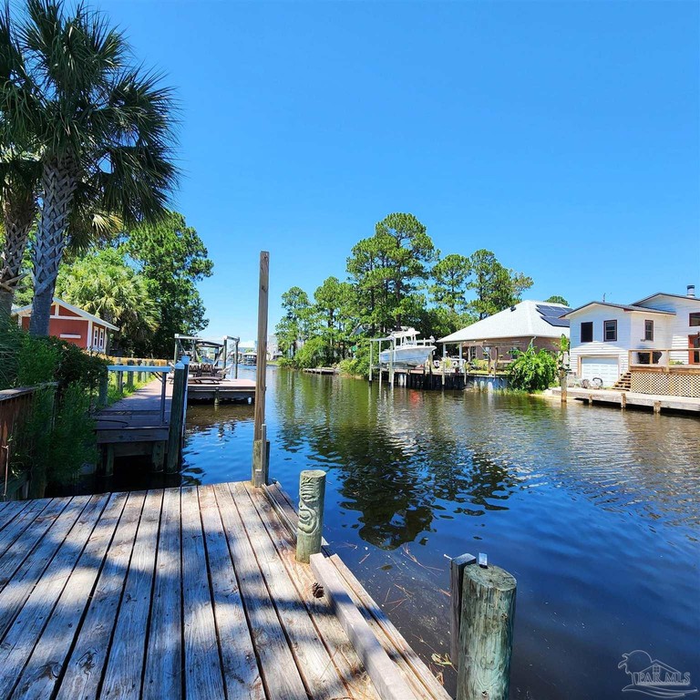 Adorable canal cottage The open floor plan features a spacious - Beach Home for sale in Gulf Breeze, Florida on Beachhouse.com