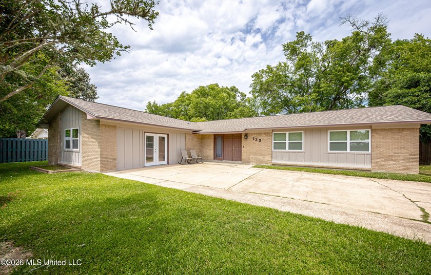 Located in Ocean Springs' desirable Golf Cart District, this - Beach Home for sale in Ocean Springs, Mississippi on Beachhouse.com