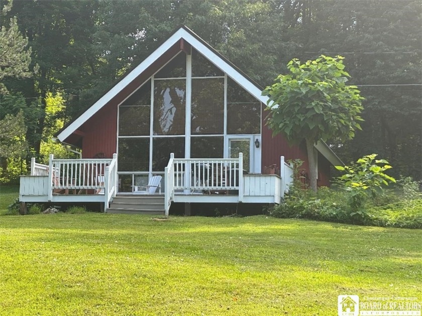 Nestled in a serene lakeside community, this charming 2 bedroom - Beach Home for sale in Ellery, New York on Beachhouse.com