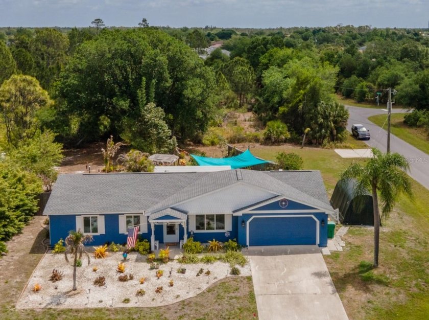This gardener's paradise is set on a CORNER DOUBLE LOT where - Beach Home for sale in Englewood, Florida on Beachhouse.com