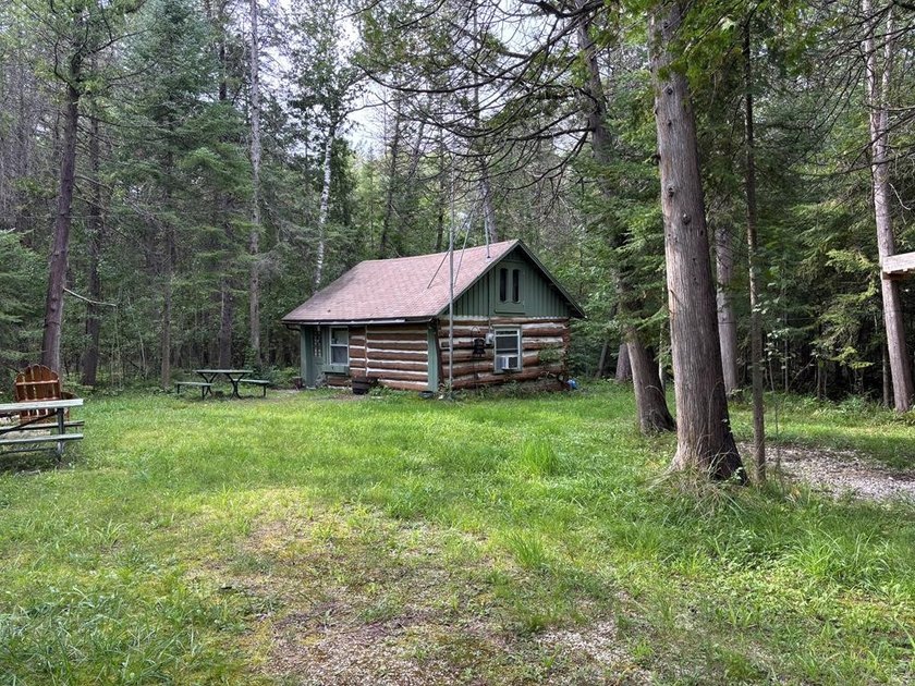 Escape to this charming rustic log cabin tucked among mature - Beach Home for sale in Sturgeon Bay, Wisconsin on Beachhouse.com