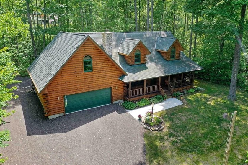 Tucked away in a private, wooded setting, this custom log - Beach Home for sale in Sturgeon Bay, Wisconsin on Beachhouse.com