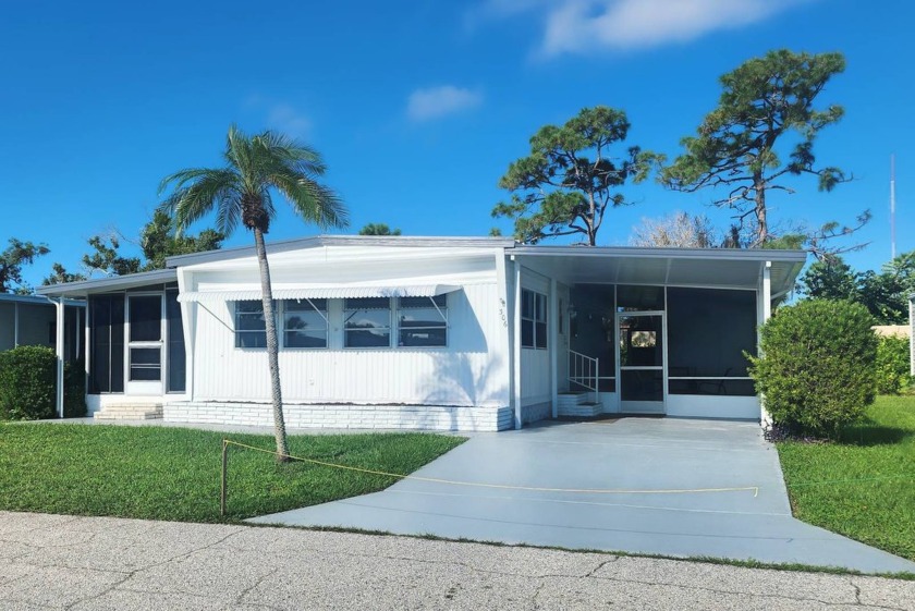 This is a remarkable double-wide manufactured home  nestled in - Beach Home for sale in Nokomis, Florida on Beachhouse.com