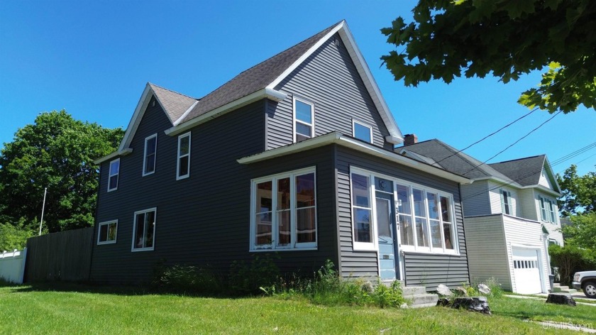 This delightful city home is a true gem, offering a blend of - Beach Home for sale in Manistique, Michigan on Beachhouse.com
