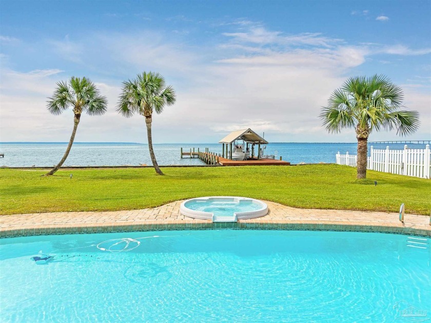 Discover the epitome of bayfront luxury in the serene Whisper - Beach Home for sale in Gulf Breeze, Florida on Beachhouse.com