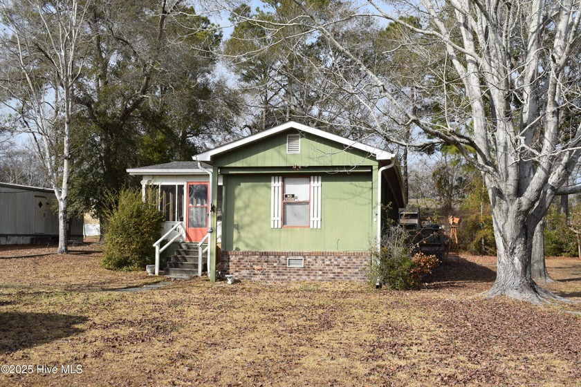 This well-cared for home, located on a quiet street, is just - Beach Home for sale in Sunset Beach, North Carolina on Beachhouse.com