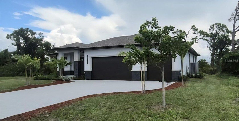 WOW!!! Step into refined coastal living in this brand-new custom - Beach Home for sale in Placida, Florida on Beachhouse.com