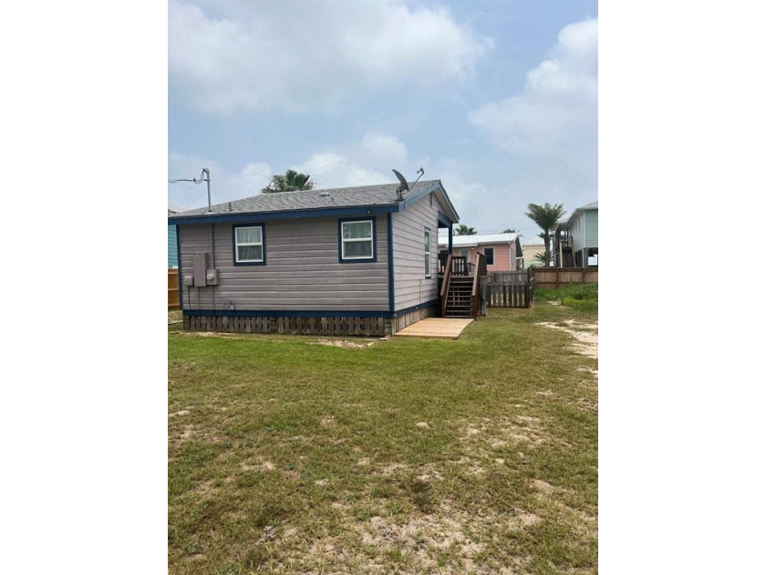 This adorable cozy coastal cottage sits on a large lot just 2 - Beach Home for sale in Rockport, Texas on Beachhouse.com