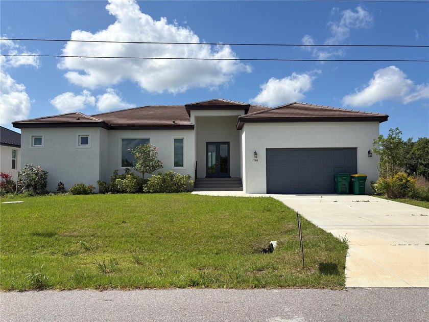 Discover this stunning new 3-bedroom, 3.5-bathroom residence - Beach Home for sale in Port Charlotte, Florida on Beachhouse.com