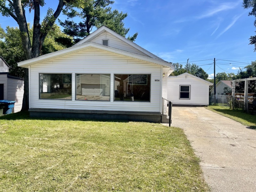 Welcome to this delightful 3-bedroom, 2-bathroom bungalow - Beach Home for sale in Muskegon, Michigan on Beachhouse.com