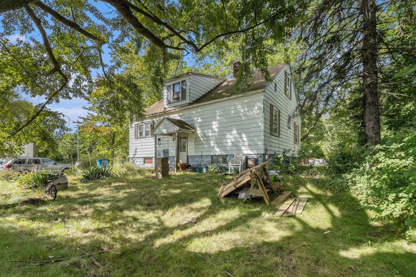 Discover a promising investment opportunity in the charming town - Beach Home for sale in Spring Lake, Michigan on Beachhouse.com