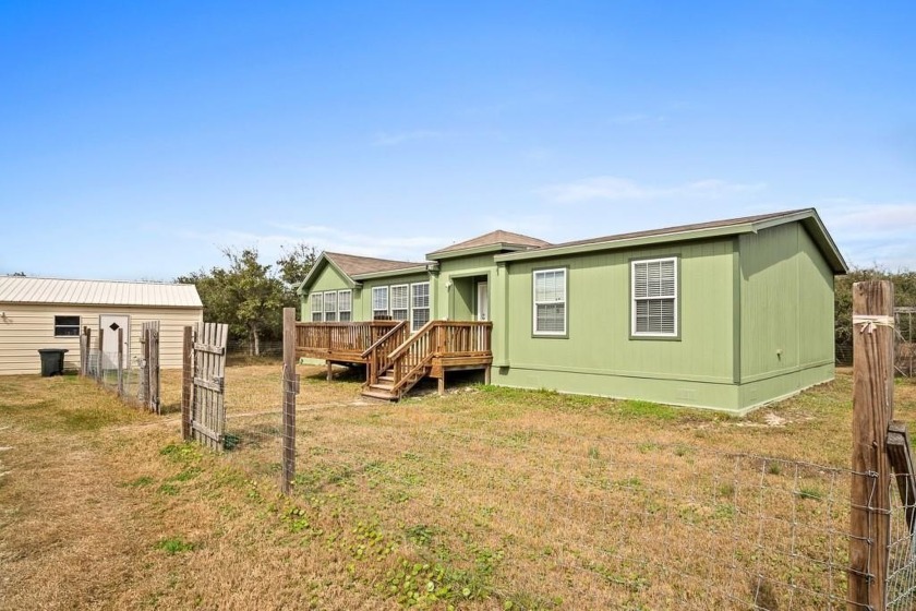 The modular home with its open-concept design, stone veneer, and - Beach Home for sale in Aransas Pass, Texas on Beachhouse.com