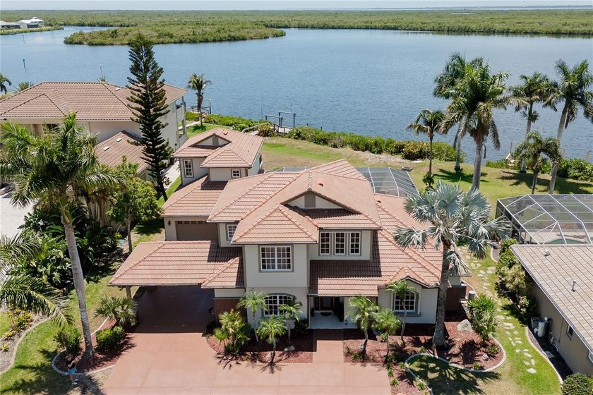 STUNNING LUXURY BAYFRONT HOME ON OVERSIZED LOT WITH GULF ACCESS - Beach Home for sale in Port Charlotte, Florida on Beachhouse.com