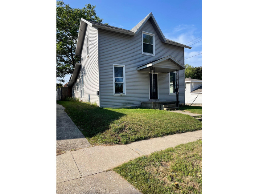 Totally remodeled and  move in ready! This three Bedroom home on - Beach Home for sale in Manistee, Michigan on Beachhouse.com